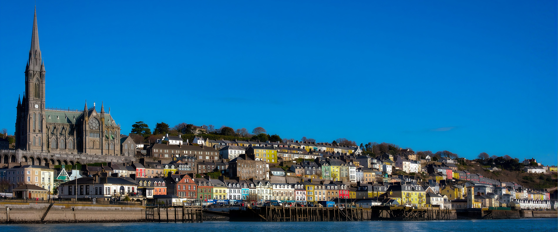 Cobh harbour with St Colman's Cathedral and colourful houses, Ireland